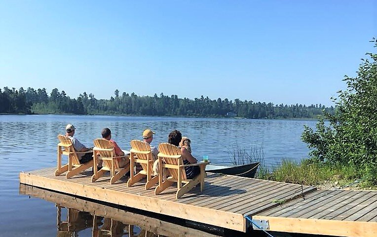 People leisurely reclining on chairs